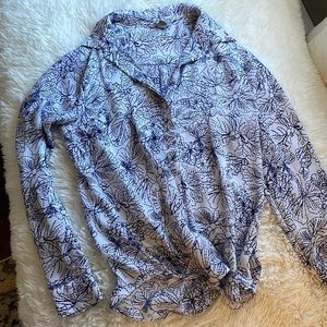 White blouse with blue floral print. Size 8. Silk like material.